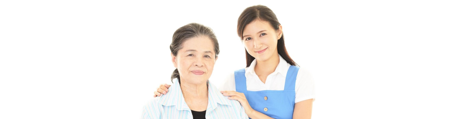 senior woman and female caregiver smiling